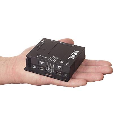Top/side view of a right hand holding a black, kg - 250 x Inline Network Encryptor with the Viasat logo in white